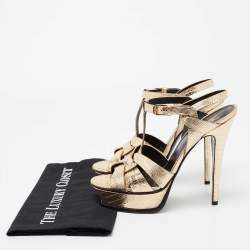 مملوكة مسبقًا صندل إيف سان لوران تربيوت جلد نقشة السحلية ذهبي ميتاليك بحزام للكاحل نعل سميك مقاس 39