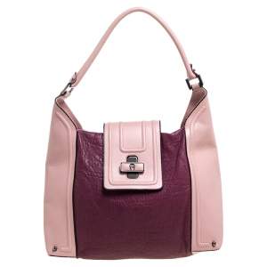 مملوكة مسبقًا حقيبة إيغنر جلد ثنائي اللون بقفل دوار وقلاب