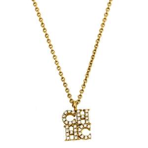 Pre Owned CH Carolina Herrera Crystal Logo Pendant Gold Tone Necklace