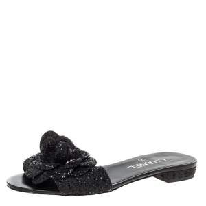 Pre Owned Chanel Black Coarse Glitter Fabric Camellia Embellished CC Flat Slides Size 37.5