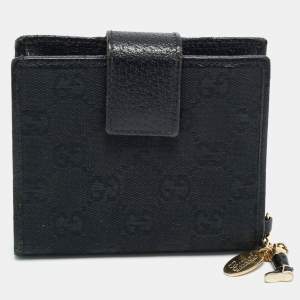 مملوكة مسبقًا محفظة مدمجة قلاب جلد وكانفاس جي جي سوداء من غوتشي مزينة بسحر البوت