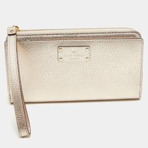 Pre Owned Kate Spade Metallic Peach Leather  Wellesley Wristlet Wallet