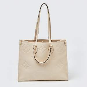 Pre Owned Louis Vuitton Creme Monogram Empreinte Leather Onthego GM Bag