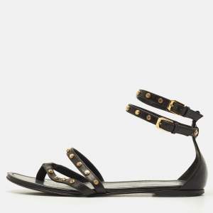 مملوكة مسبقًا صندل سان لوران تريبوت جلد أسود بحزام للكاحل مسطح مقاس 38