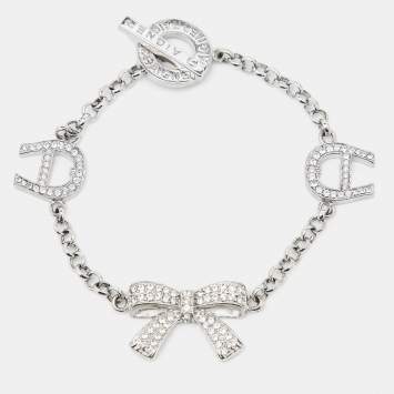 Pre Owned Aigner Logo Bow Crystals Silver Tone Bracelet