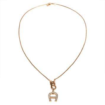 Pre Owned Aigner Gold Tone Crystal Logo Pendant Necklace