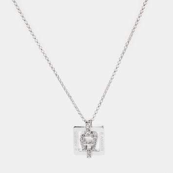 Pre Owned Aigner Silver Tone Square Crystal Logo Pendant Necklace