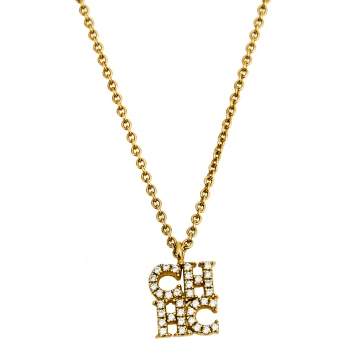 Pre Owned CH Carolina Herrera Crystal Logo Pendant Gold Tone Necklace