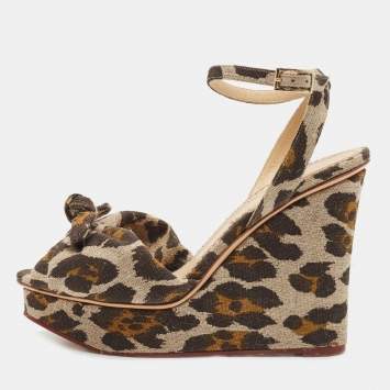 مملوكة مسبقًا Charlotte Olympia Beige/Brown Leopard Canvas Bow Platform Ankle Strap Wedge Sandals Size 38.5
