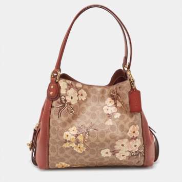 Pre Owned Coach Beige/Brown Signature Prairie Floral Canvas and Leather Edie 31 Satchel