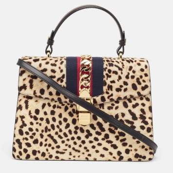 Pre Owned Gucci Beige/Black Leopard Print Calfhair and Leather Medium Sylvie Top Handle Bag