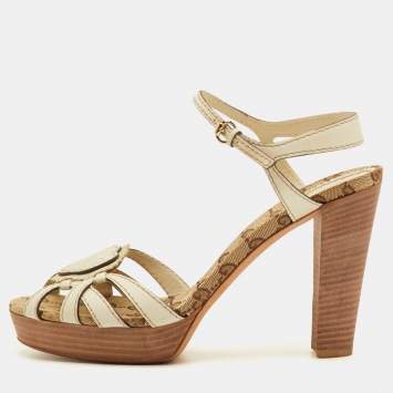 Pre Owned صندل منصة بحزام للكاحل كانفاس GG وجلد كريمي قلب شعار قوتشي مقاس 39.5