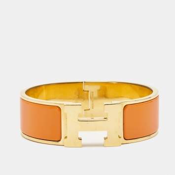 Pre Owned Hermès Clic Clac H Orange Enamel Gold Plated Wide Bracelet 