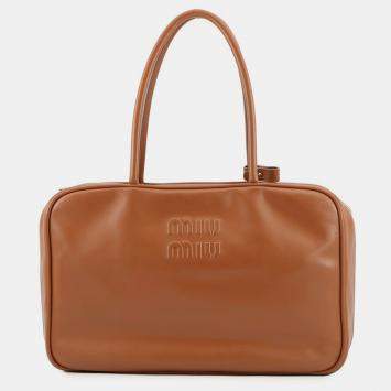 مملوكة مسبقًا حقيبة بو ميو ميو جلد كونياك حجم كبير