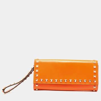Pre Owned Valentino Neon Orange Leather Rockstud Trifold Wristlet Clutch