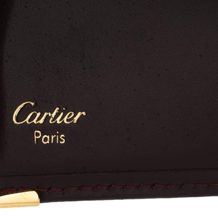 Pre Owned Cartier Maroon Leather Must De Cartier 6CC Bifold Wallet
