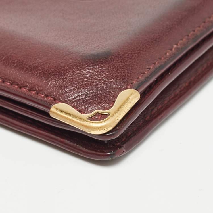 Pre Owned Cartier Burgundy Leather Must De Cartier Bifold Card Holder 