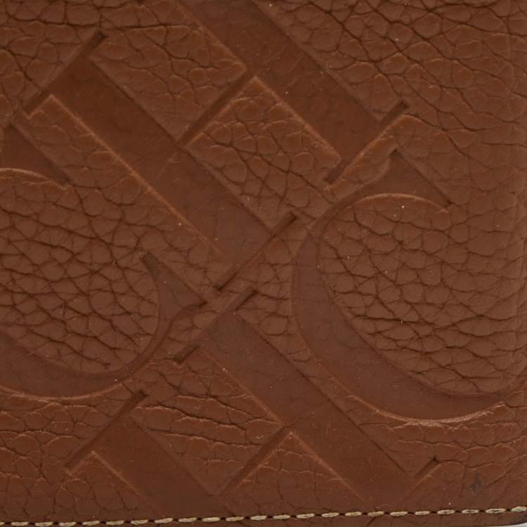 Pre Owned CH Carolina Herrera Brown Monogram Embossed Leather Bifold Wallet