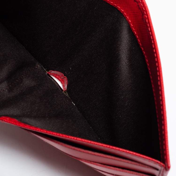 Pre Owned CH Carolina Herrera Red Leather Perforated Logo Bifold Wallet