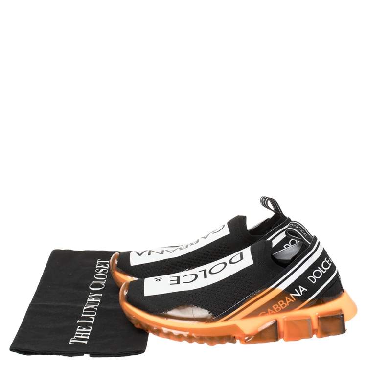 مملوكة مسبقًا Dolce & Gabbana Black/Orange Stretch Jersey Logo Print Slip On Sneakers Size 39