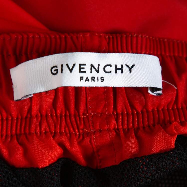 Pre Owned Givenchy Neon Orange Synthetic Logo Printed Track Shorts M