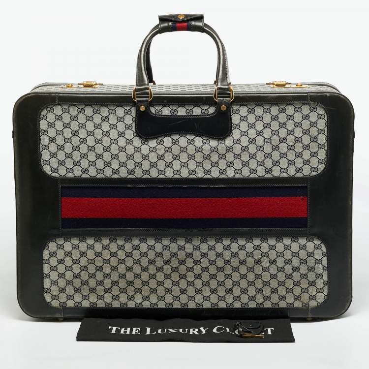 مملوكة مسبقًا حقيبة سفر غوتشي ترانك نسج GG أزرق كحلي/أسود وجلد