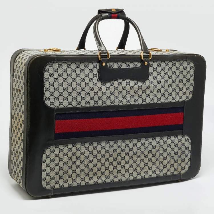 مملوكة مسبقًا حقيبة سفر غوتشي ترانك نسج GG أزرق كحلي/أسود وجلد