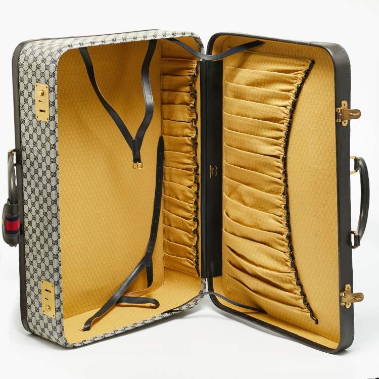 مملوكة مسبقًا حقيبة سفر غوتشي ترانك نسج GG أزرق كحلي/أسود وجلد