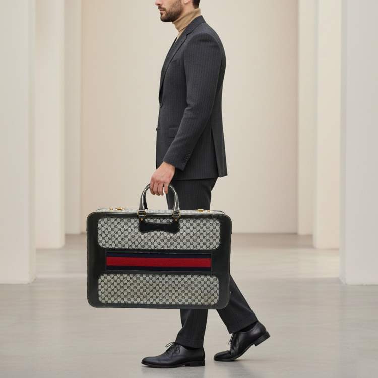 مملوكة مسبقًا حقيبة سفر غوتشي ترانك نسج GG أزرق كحلي/أسود وجلد