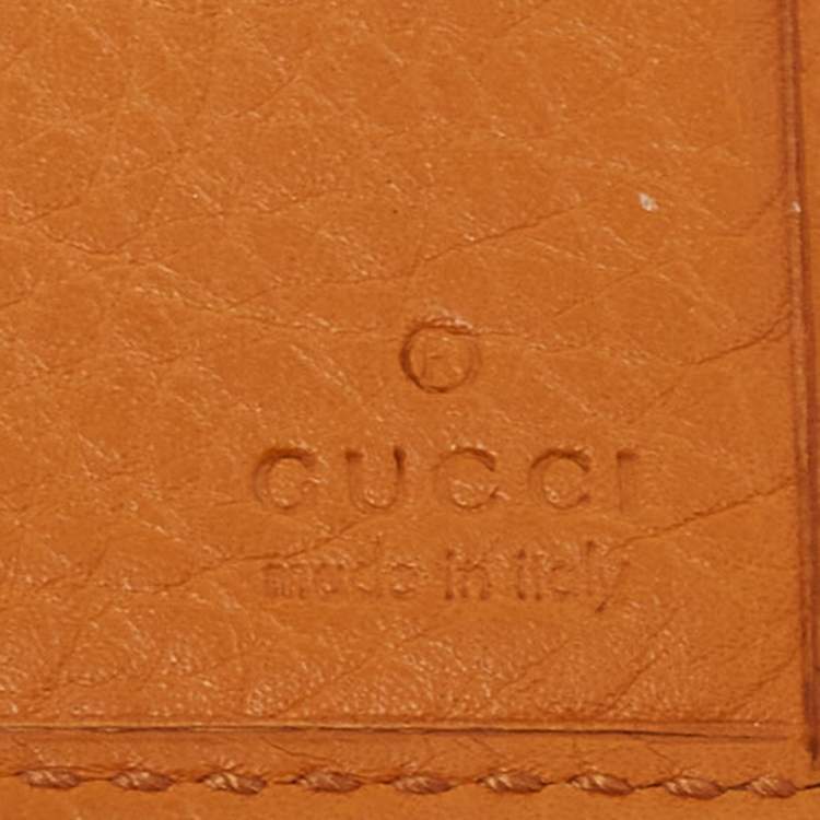 Pre Owned Gucci Orange Leather Interlocking G Bifold Wallet