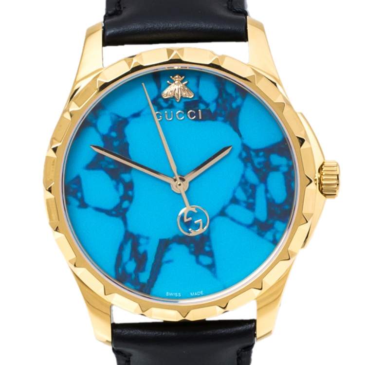 Pre Owned Gucci Turquoise Blue Gold Tone Stainless Steel Leather G-Timeless 126.4 Men's Wristwatch 38 mm