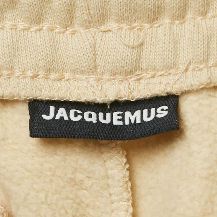 مملوكة مسبقًا بنطلون جاكيموس بيج بشعار قطن مقاس كبير