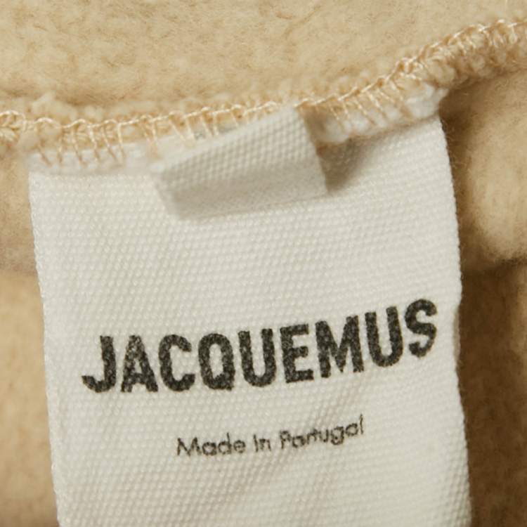 مملوكة مسبقًا بنطلون جاكيموس بيج بشعار قطن مقاس كبير