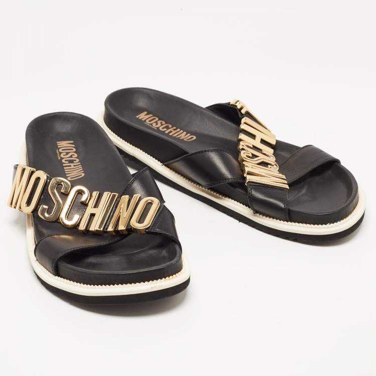 Pre Owned Moschino Black Leather Cross Strap Logo Detail Slides Size 44