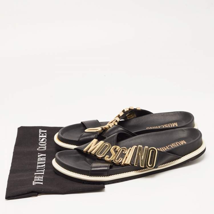 Pre Owned Moschino Black Leather Cross Strap Logo Detail Slides Size 44