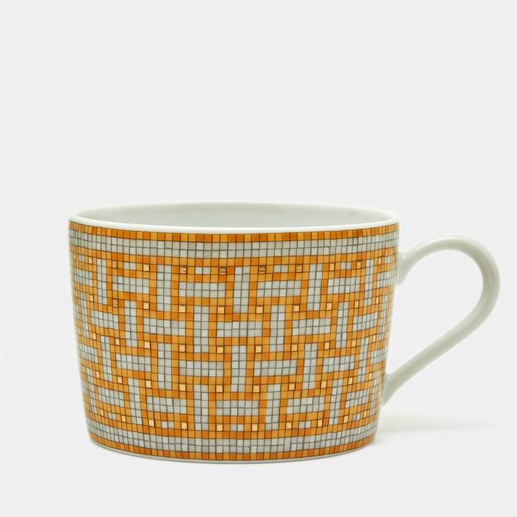 Pre Owned Herm�ès Mosaique AU 24 Gold Tea Cup and Saucer Set
