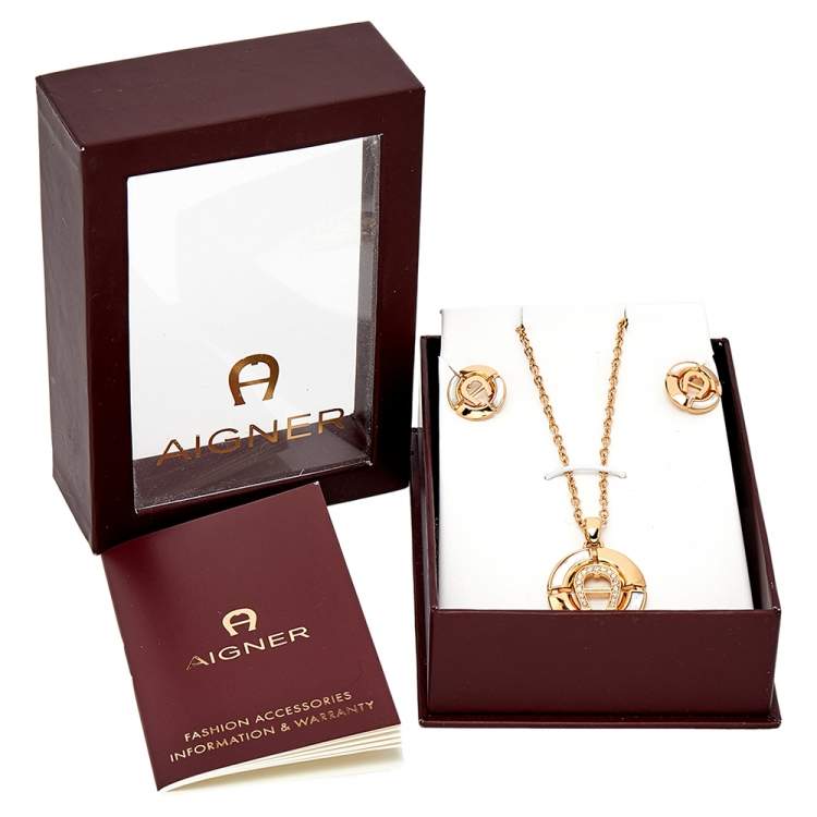 Pre Owned Aigner Gold Tone Crystal Logo Earring & Pendant Necklace Set