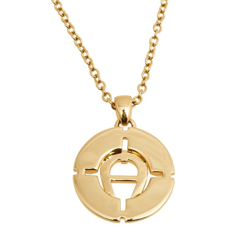 Pre Owned Aigner Gold Tone Crystal Logo Earring & Necklace Set