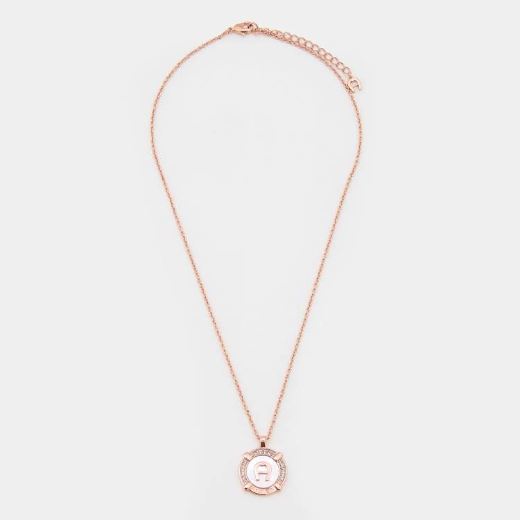 Pre Owned Aigner Rose Gold Tone Crystal & Mother of Pearl Logo Pendant Necklace