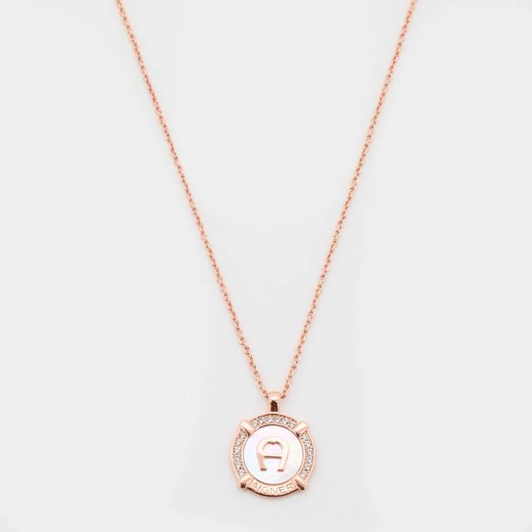 Pre Owned Aigner Rose Gold Tone Crystal & Mother of Pearl Logo Pendant Necklace