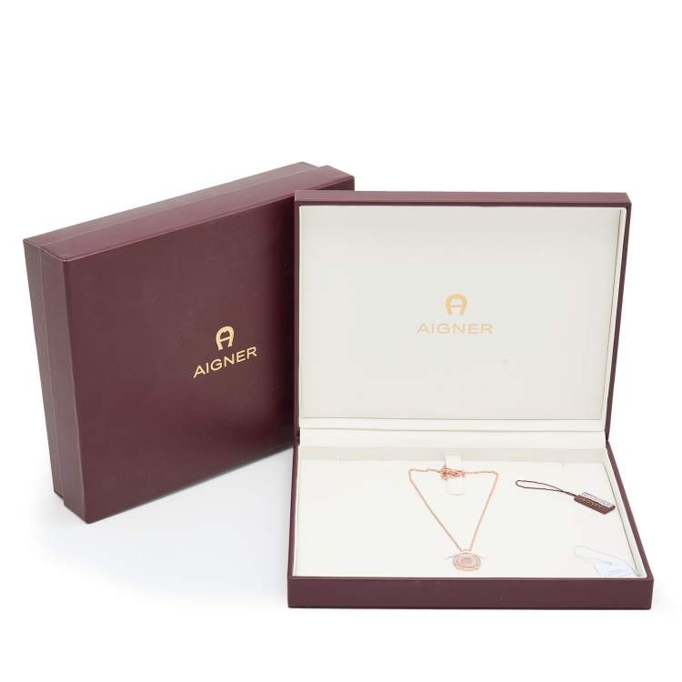 Pre Owned Aigner Rose Gold Tone Crystal & Mother of Pearl Logo Pendant Necklace