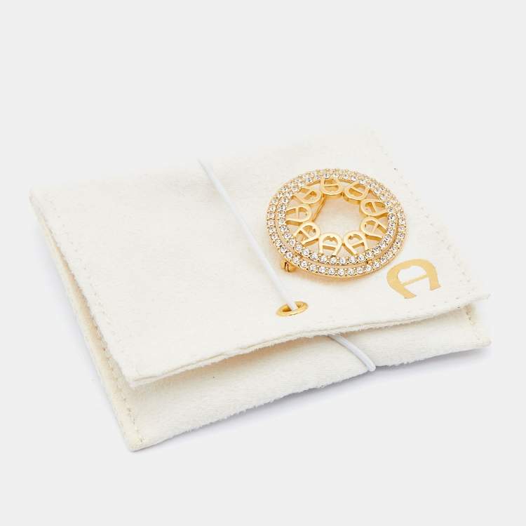 مملوكة مسبقًا Aigner Gold Tone Crystal Embellished Logo Round Brooch