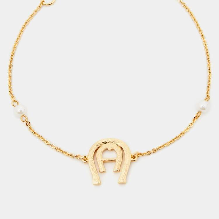 Pre Owned Aigner Crystal Faux Pearl Gold Tone Bracelet