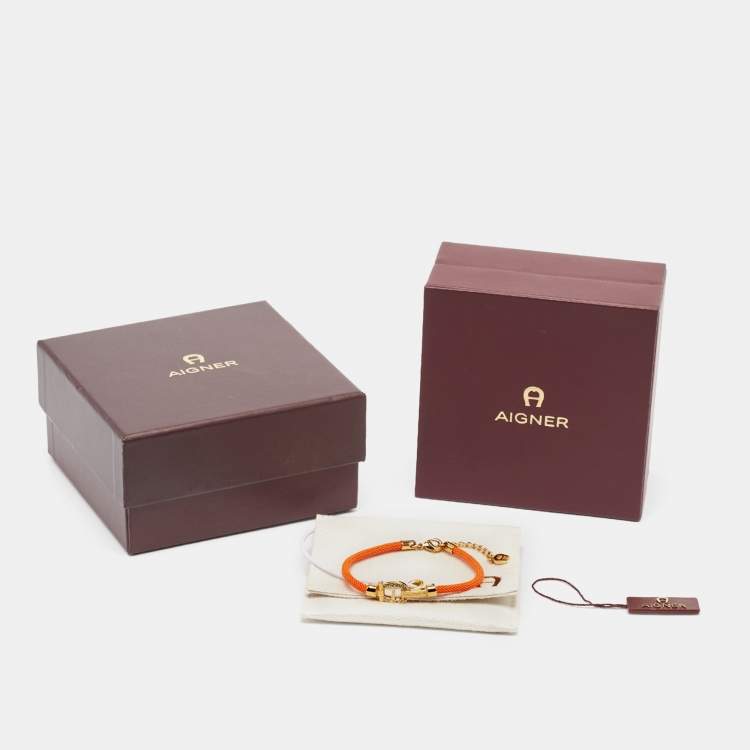 Pre Owned Aigner Orange Silk Cord Crystal Logo Yael Bracelet