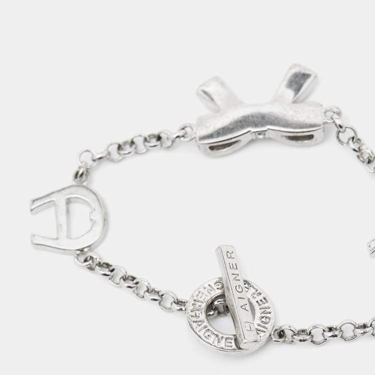 Pre Owned Aigner Logo Bow Crystals Silver Tone Bracelet