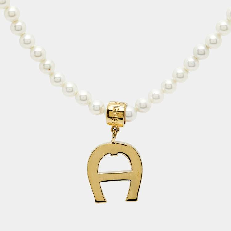 Pre Owned Aigner Logo Faux Pearl Crystal Gold Tone Necklace