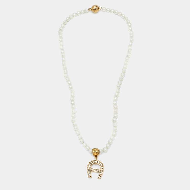 Pre Owned Aigner Logo Faux Pearl Crystal Gold Tone Necklace