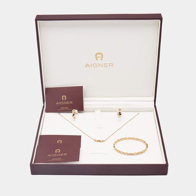 Pre Owned Aigner Crystal Logo Gold Tone Bracelet Earring and Necklace Set