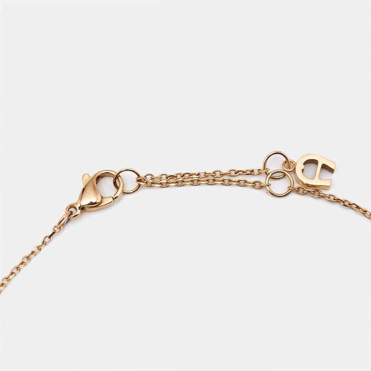 Pre Owned Aigner Crystal Logo Gold Tone Bracelet Earring and Necklace Set