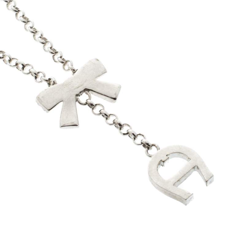 Pre Owned Aigner Crystal Studded Bow Silver Tone Long Toggle Necklace 